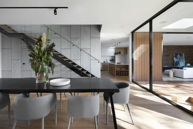 An open-plan family kitchen with an island and ceiling-height cabinetry